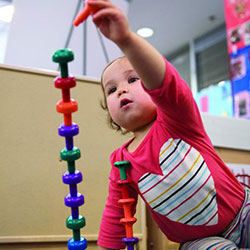 Baby building with toys